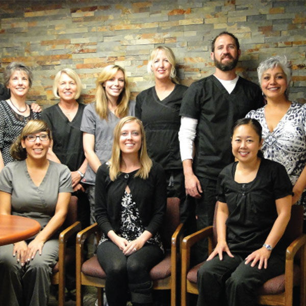 office staff posing for a picture