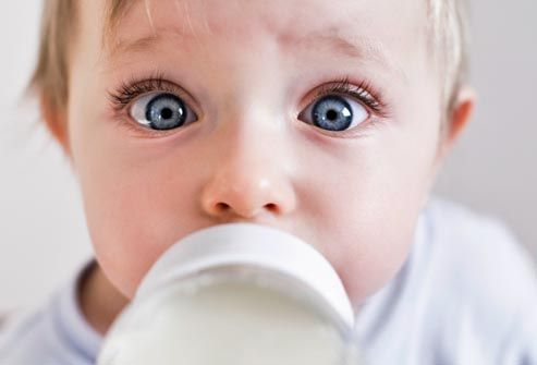 Close up of baby with bottle