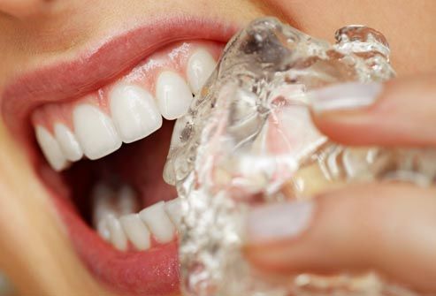 Close up view of woman eating an ice