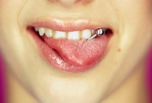 Close up of girl's tongue piercings