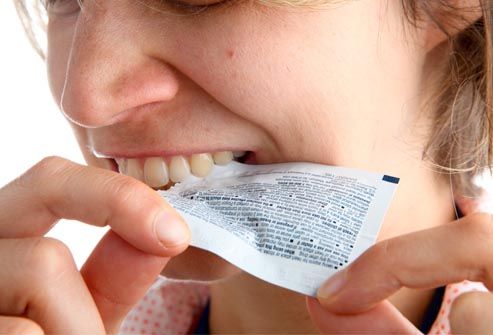 Woman Opening Stuff With Teeth