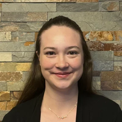 A headshot photo of front desk staff Autumn
