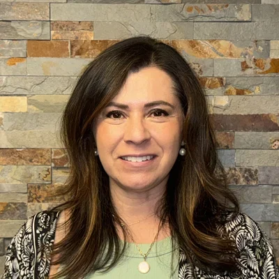 A headshot photo of insurance coordinator Carla