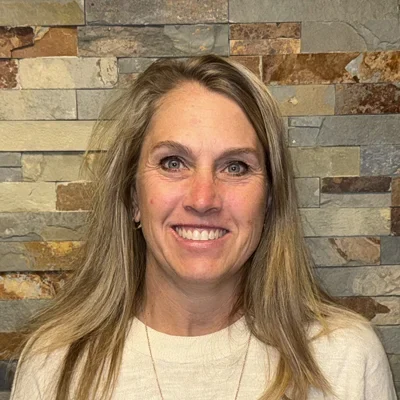 A headshot photo of office manager Stephanie